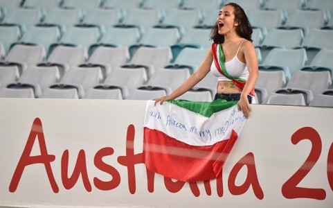 A fan of Iran cheers during their game against Qatar  Photo: AFP/Getty Images